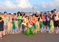 Surfside beach: photo of croatians in Hawaiian ornaments
