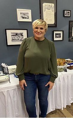 Bernardica posing in the front of food table